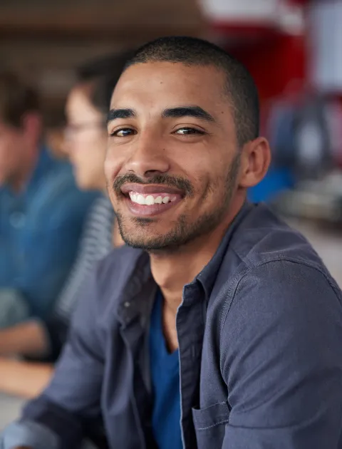 Diverse group of working adults who study at UK universities with YoUni Mentor